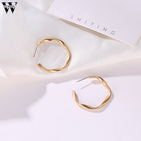Image of Distortion Gold Round Earrings - Rosecolor